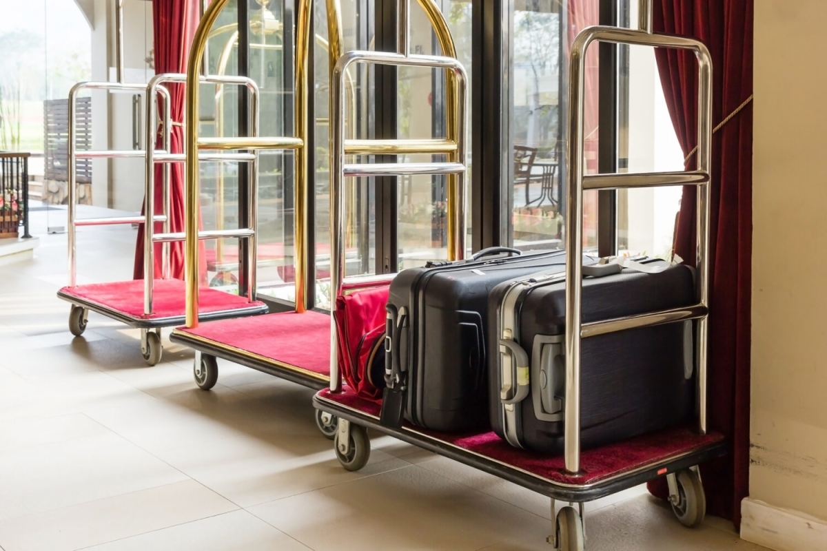 Hotel luggage cart / baggage trolley in the hotel lobby hallway background or Bellman's luggage cart vecteezy_hotel-luggage-trolleys_1903998
